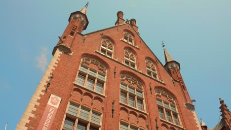 low angle of architecture markt building on central square in bruges, belgium