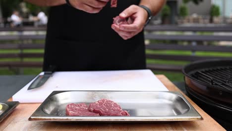 preparing beef steaks for outdoor grilling