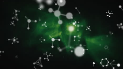 animation of molecules spinning on green background