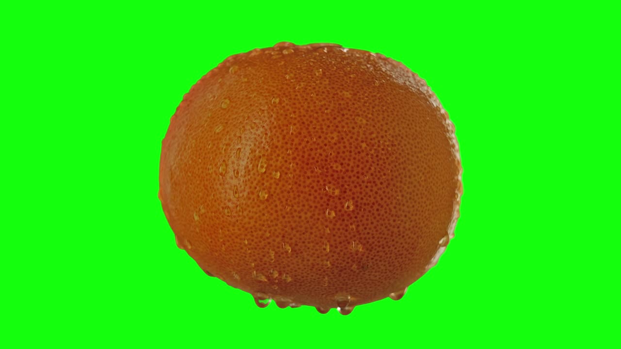 naranja sabrosa y húmeda en la pantalla verde para la llave de croma