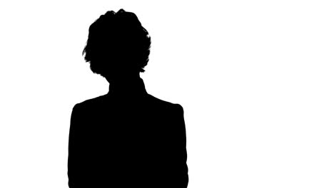 silhouette young beautiful business woman in a suit, smiling, happy, working with a tablet, writing a message track matte