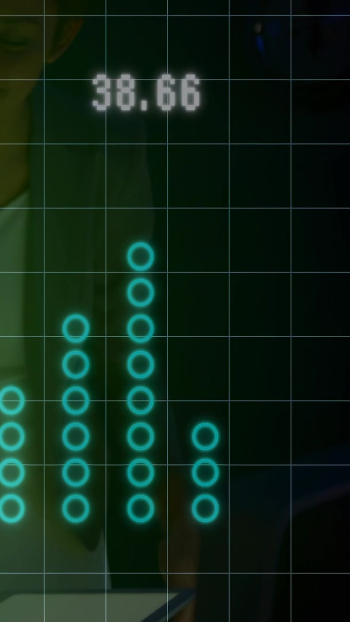 Vertical video: Man at table tapping tablet causing HUD rings, readout falling then rising for tech