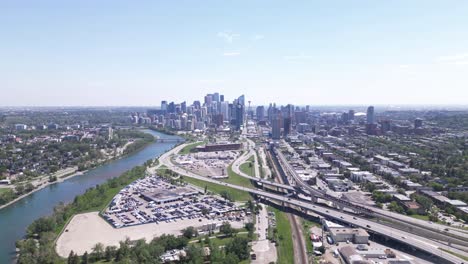 a drone flies towards calgary's downtown overtop of 2 major corridors bringing traffic in and out of downtown