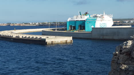 large ferry of the balearia company waiting in the port of ciutadella on the island of menorca in spain, sunny day