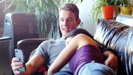 Couple-relaxing-on-sofa