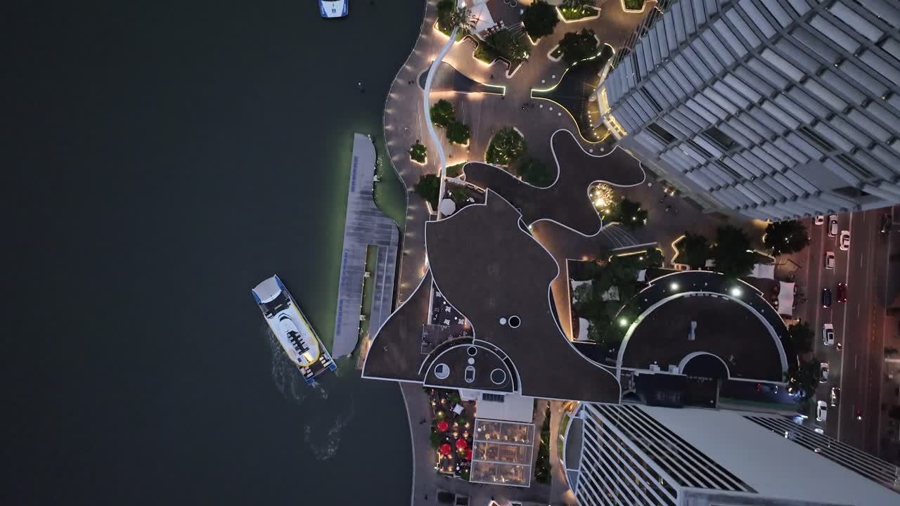 Topdown aerial shot of Brisbane City's Eagle Street Pier boardwalk at night time