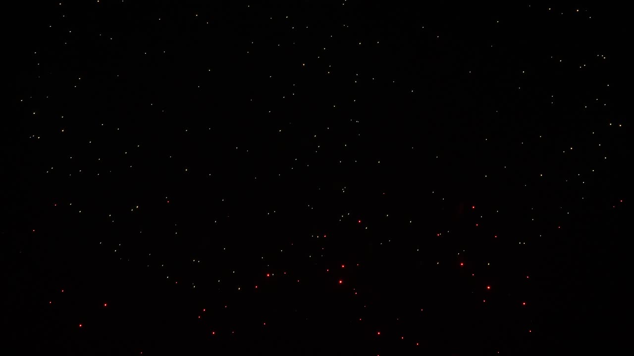 Real fireworks on deep black background sky, beautiful colorful fireworks shiny display at night, real time 4k footage.