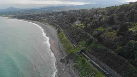 Train-travelling-near-the-sea-on-the-beach-on-a-bright-sunny-day