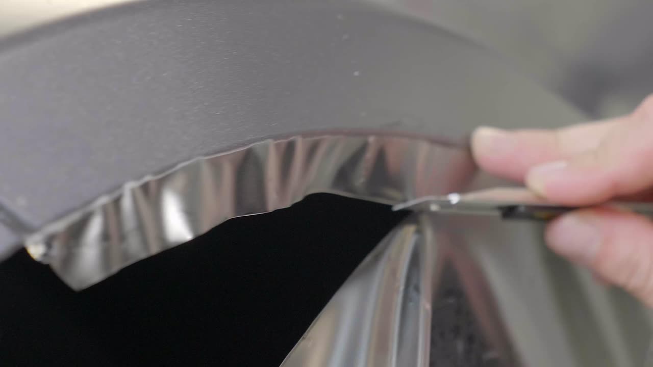 Cutting of Vinyl Foil with Utility Knife, Close Up Car Wrapping FOLLOW