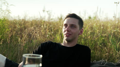 young man talking outdoors