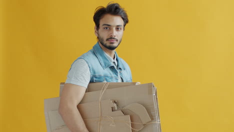 man with recycled cardboard