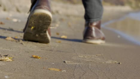 Walking-by-the-ocean-on-a-Sandy-beach-in-Fall