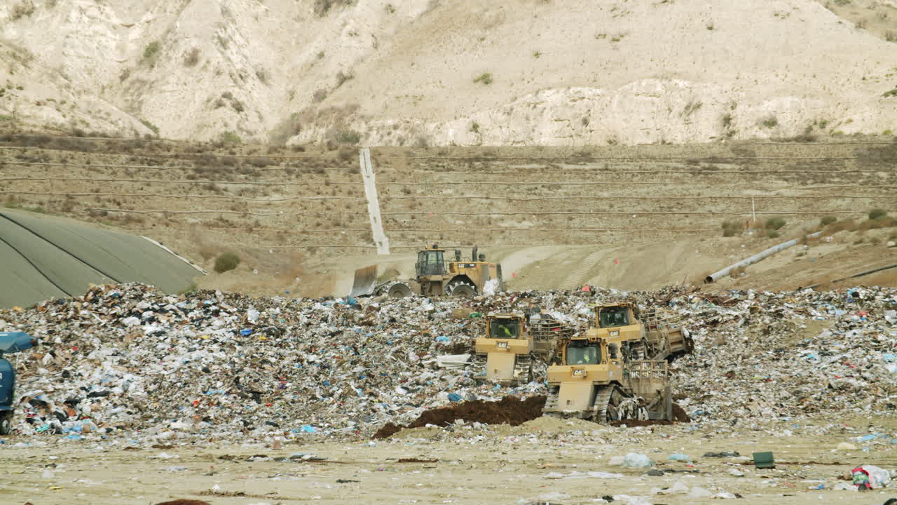 Heavy equipment working at a large landfill site