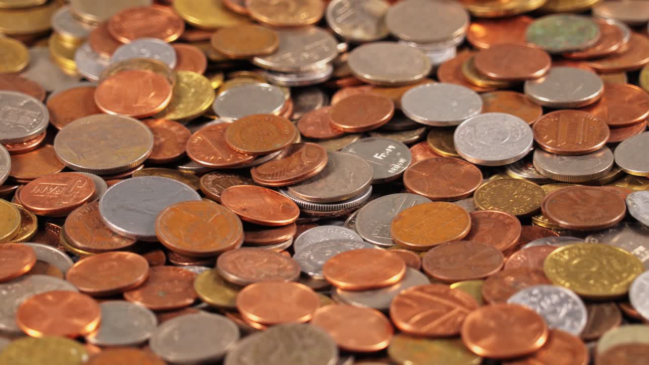 Coins scattered on a flat surface for collection or counting