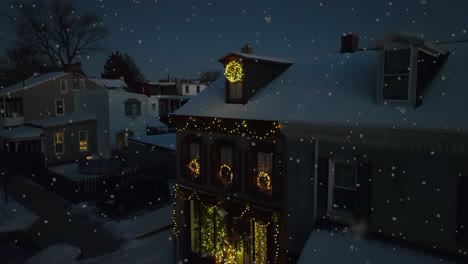 lighting christmas decorated home at night during snowfall