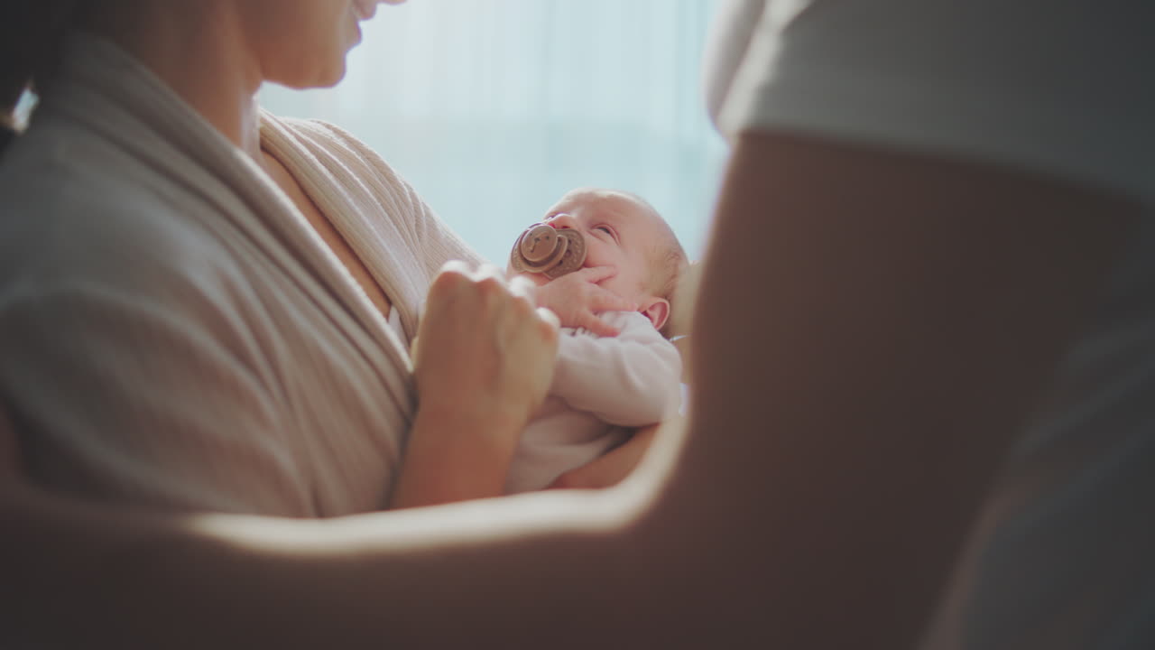 Parents lovingly holding their newborn baby
