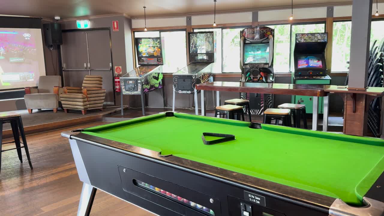 Unoccupied pool table in a sports bar