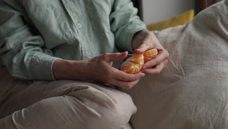 woman eating a mandarin orange