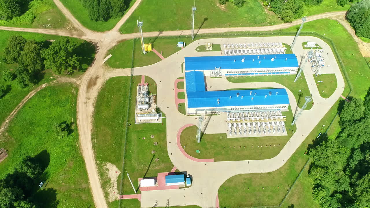 Aerial footage of the natural gas station situated within the green area