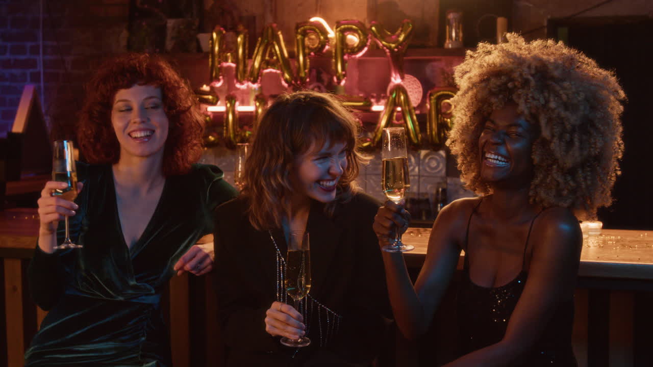 Women celebrating New Year's Eve with champagne