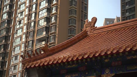 ancient chinese architekture, chinese temple with houseing blocks in background