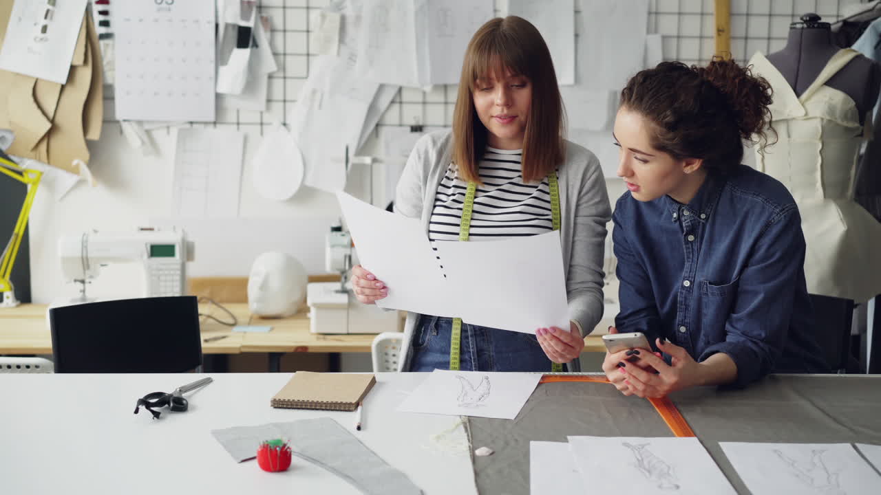 Fashion Designers Collaborating on Designs