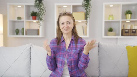 Woman-giving-greeting-and-applause-to-camera.