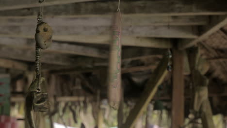medium shot of decorative waste with broken tv at a darien gap rustic house in colombia.