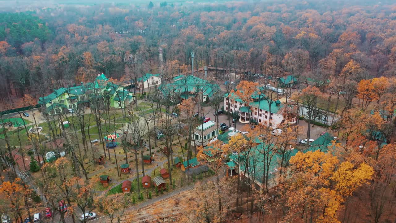 Luxury hotel aerial shot. Complex buildings surrounded by forest