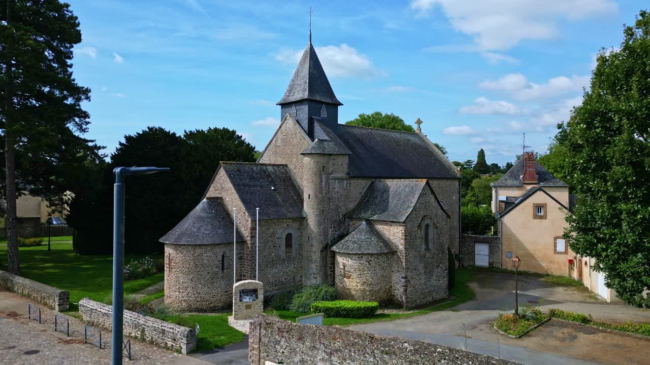 Saint-Sulpice Church, neighborhood Grenoux, Laval in France. Aerial drone backward