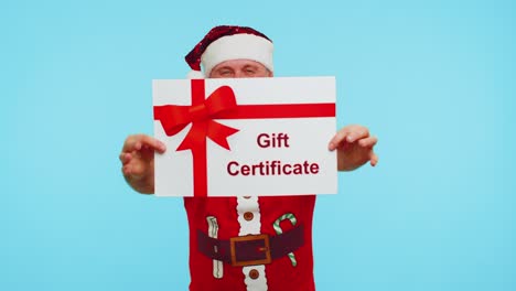 man in red t-shirt santa christmas hat presenting card gift certificate coupon voucher for winner