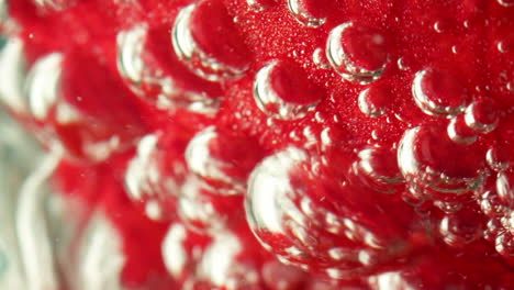 strawberry in water with bubbles