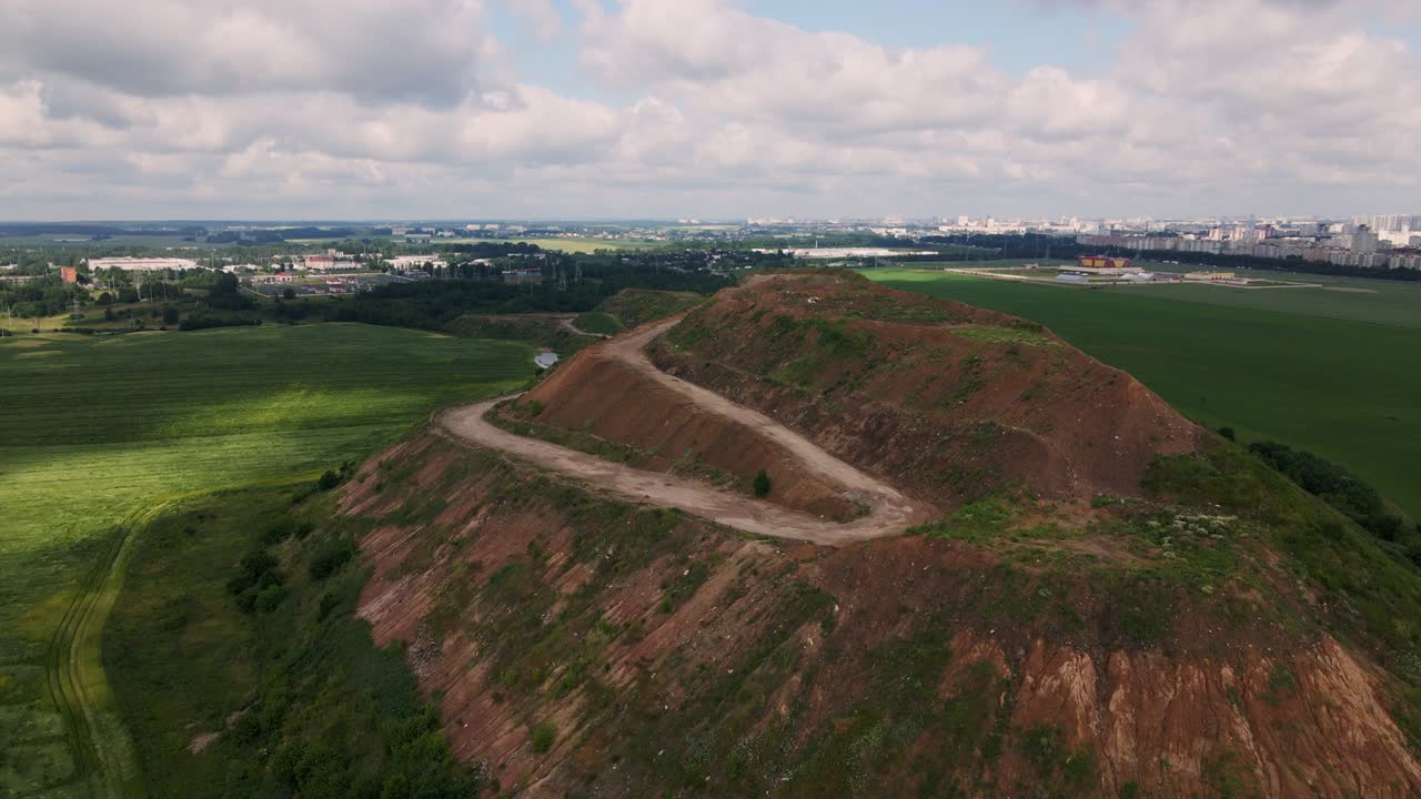 Household waste landfill. Closed for processing. Environment protection. Shooting closer to the subject. Close-up shot. Aerial photography.