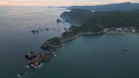 drone peninsular landscape panoramic in barra de navidad ocean mexican beach sky at sunset