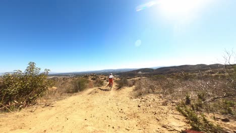 drone high speed chase downhill mtb biker off ramps doing tricks
