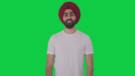 happy sikh indian man smiling green screen