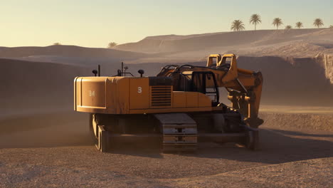 excavator in a desert landscape at sunset