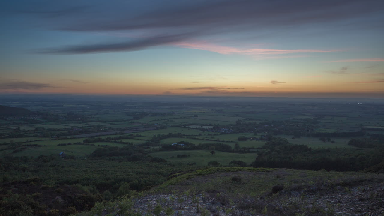 Stunning Sunset over Rolling Hills and Farmland