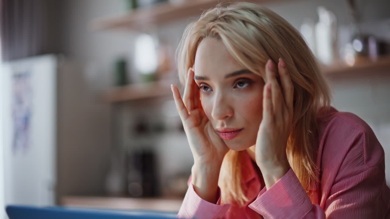 Tired freelancer having headache working in home office portrait. Woman overwork