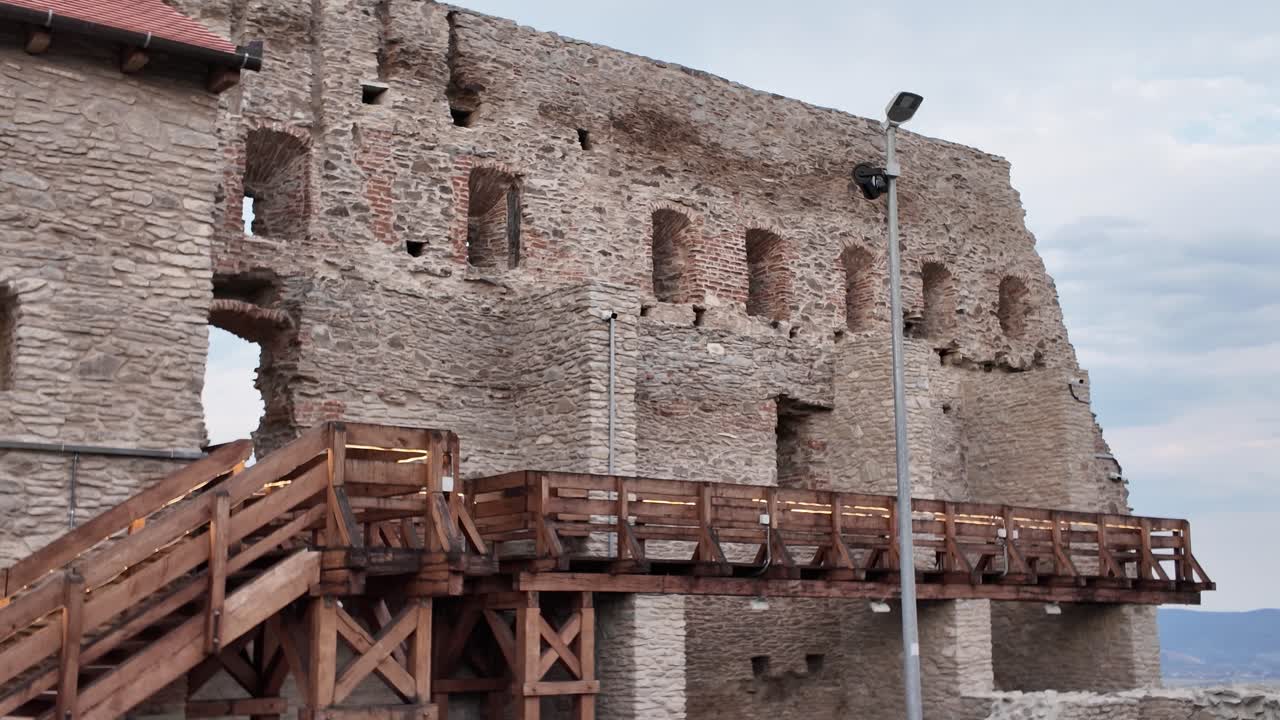 Weathered fortress walls from the historic Fortress of Deva, showcasing the rugged beauty and heritage of this ancient Transylvanian landmark
