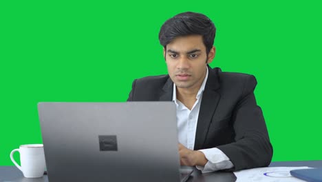 Focused-Indian-manager-working--Green-screen