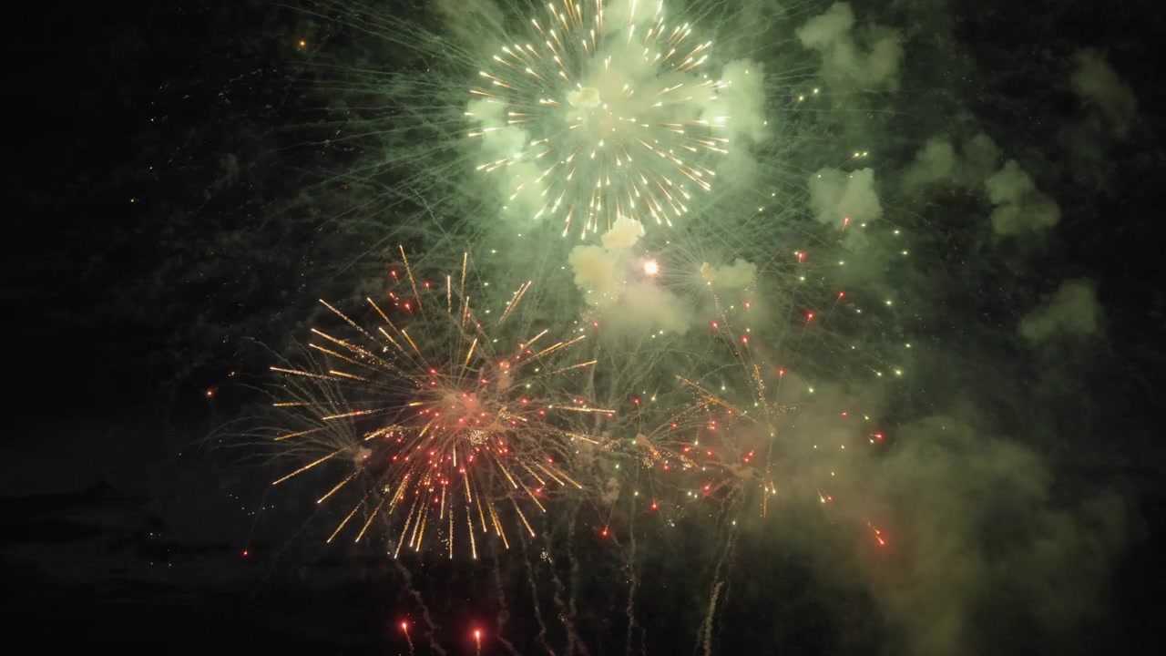 Fireworks show light up the night sky. Slow motion