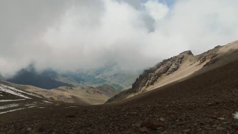 heavy clouds slowly moving towards camera in high atlas mountains, morocco