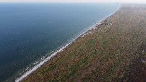 bird's eye view of the incredible wild beaches in vadu, romania, where the black sea meets the natural ecosystems filled with greenery