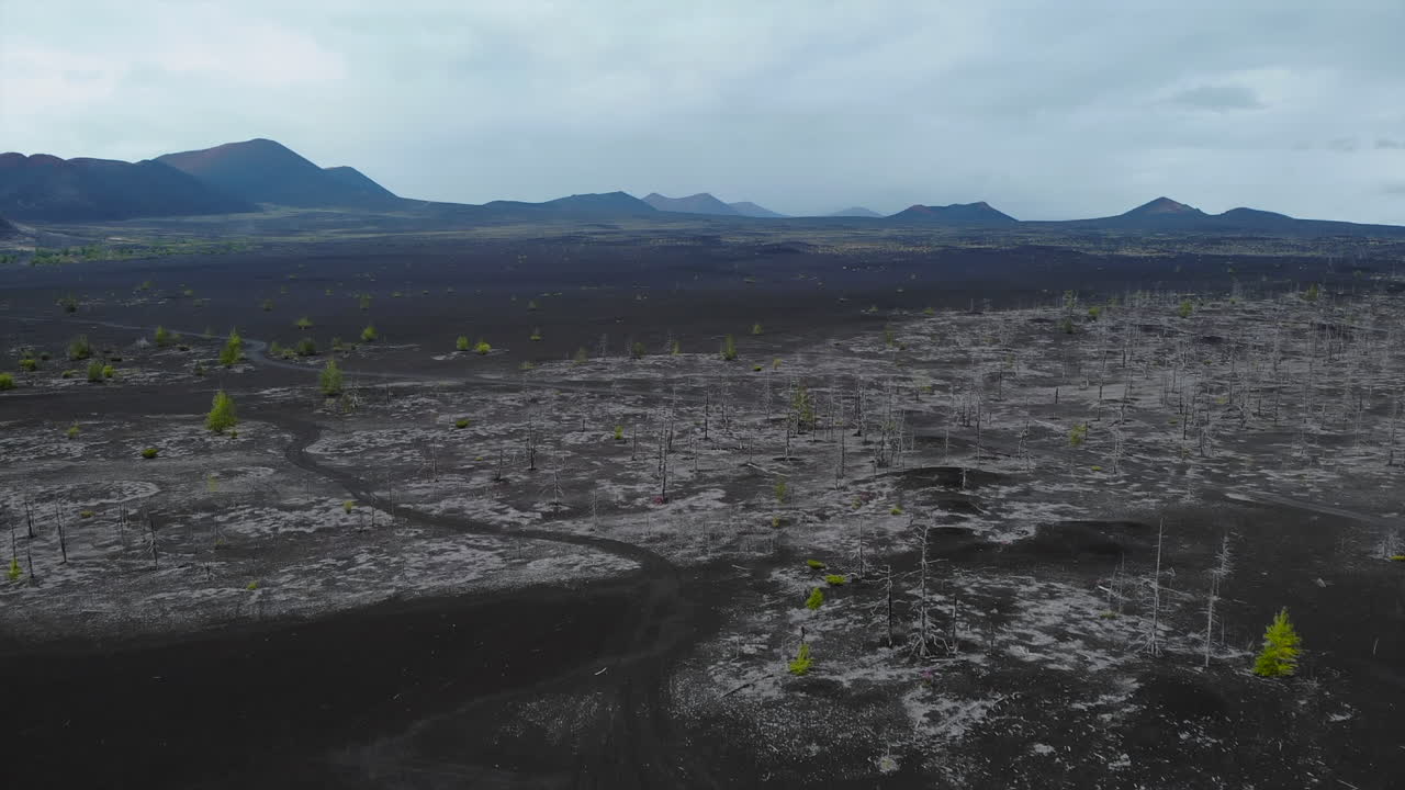 Volcanic Landscape with Barren Terrain and Mountains