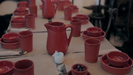 rustic red pottery table setting