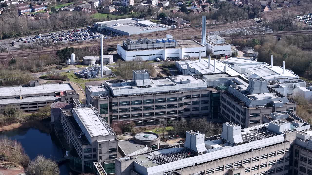 Aerial view circling GSK pharmaceutical industrial manufacturing facility offices in Stevenage, UK
