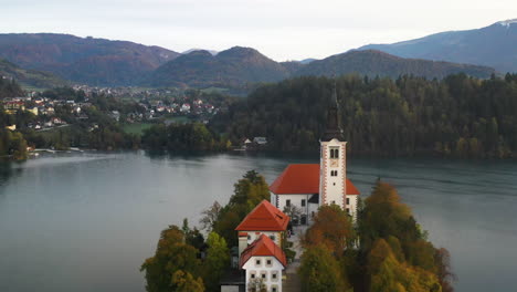 revealing cinematic drone shot of the pilgrimage church of the assumption of mary, slovenia