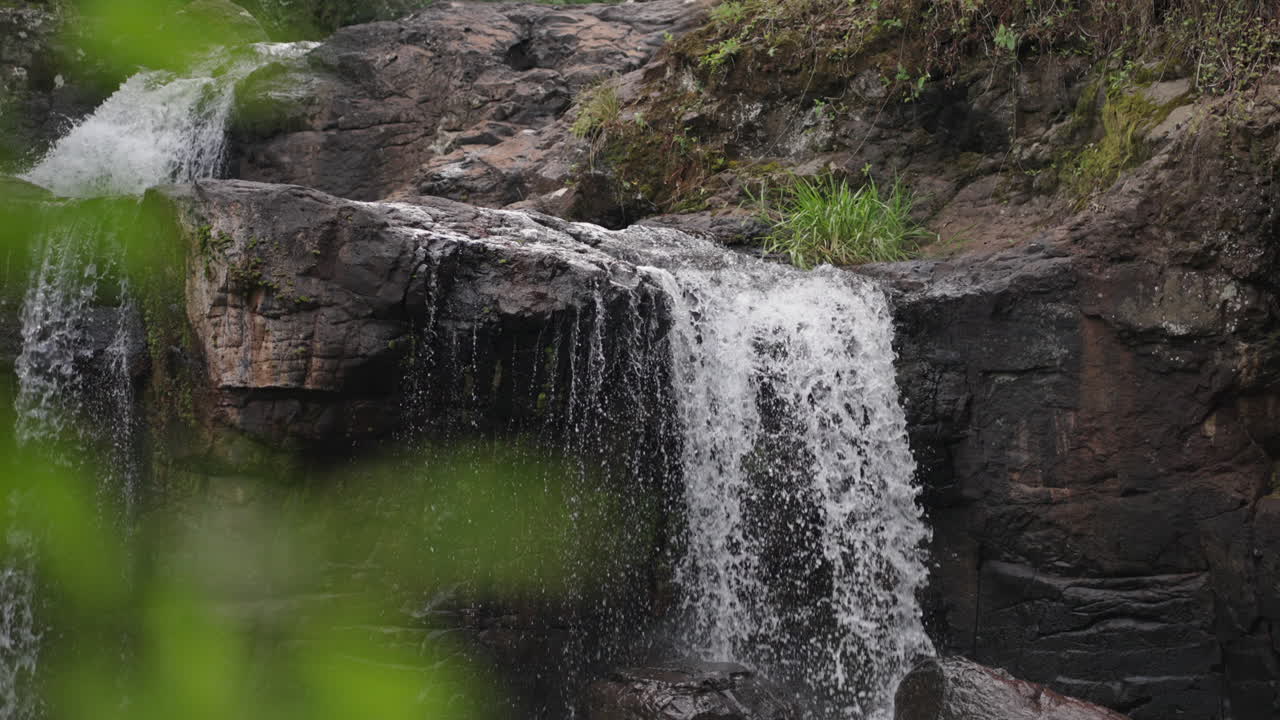 Slow motion stone waterfall landscape, water falling in Misiones Argentina Falls