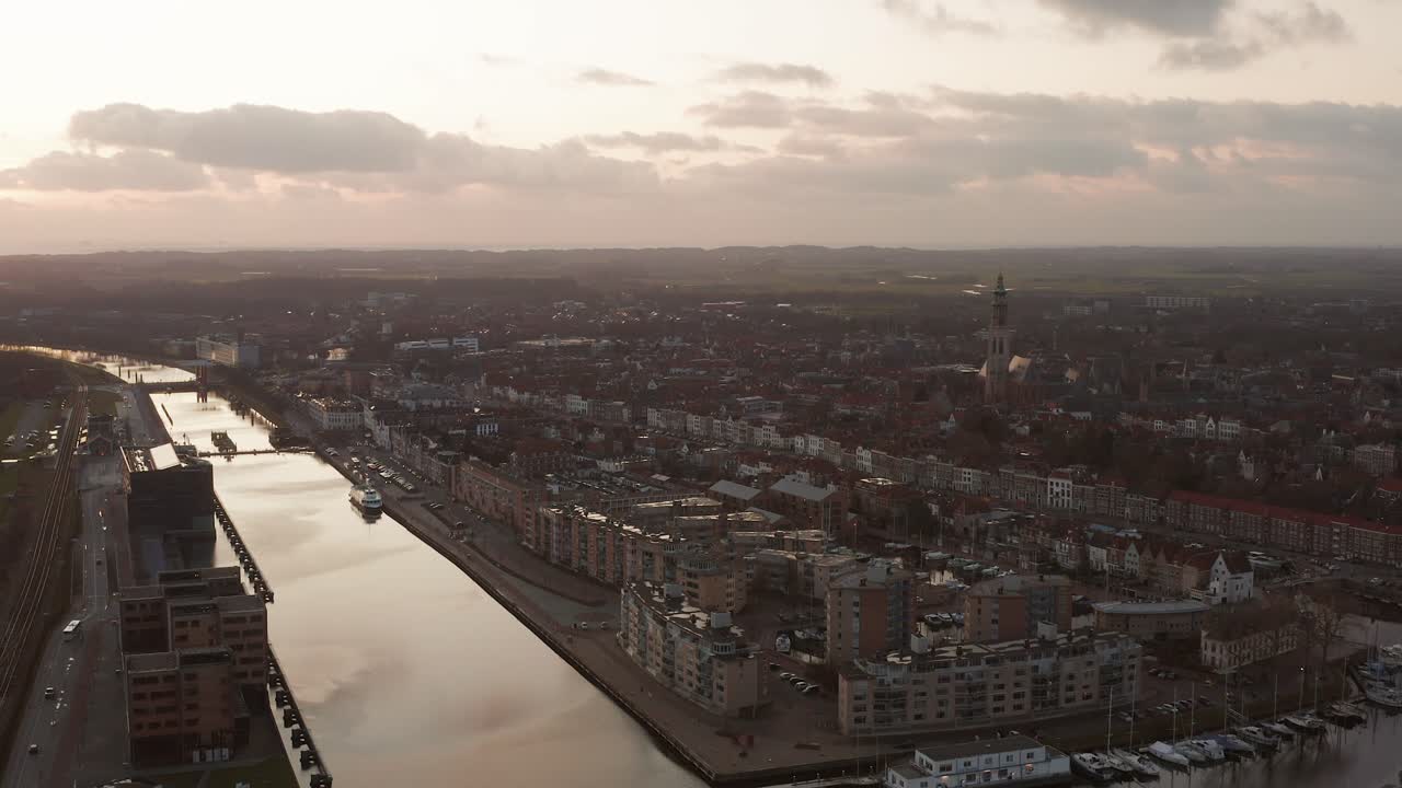 Panoramic shot of Middelburg city center and the canal during sunset. Drone shot